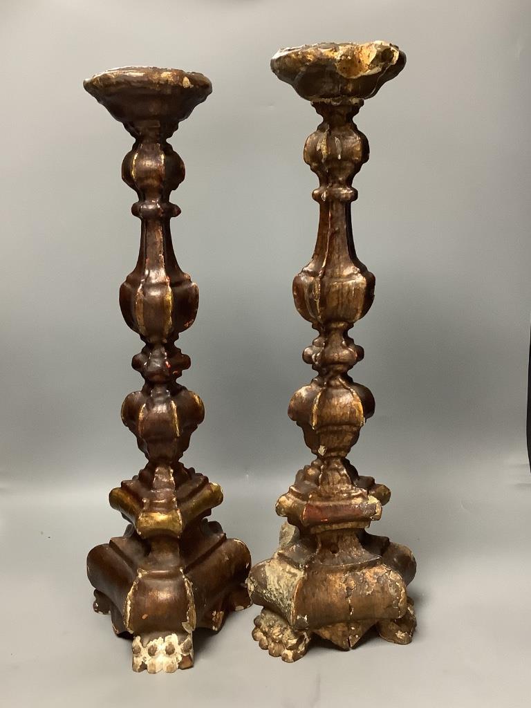 A pair of Italian Baroque style giltwood candlesticks 55cm